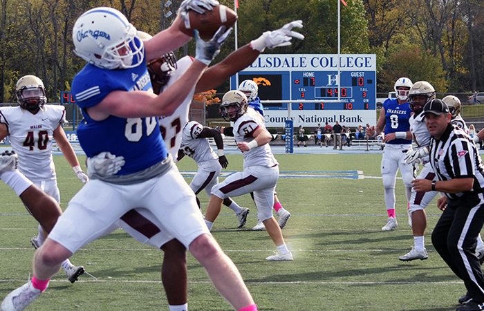 Trey Brock snags a touchdown pass from Chance Stewart during Saturday's win vs. Walsh. Photo by Carly Gouge