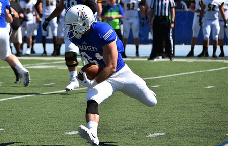 Junior Joe Reverman cuts upfield during Hillsdale's 31-27 win over Michigan Tech. Photo by Carly Gouge