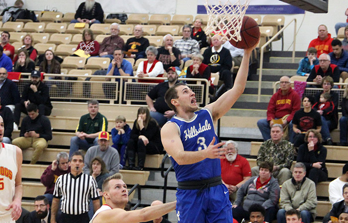 Sophomore guard Nate Neveau scores 2 of his team-high 17 in Hillsdale's gut-wrenching loss at Ferris State Tuesday night. Photo credit: Brad Monastiere