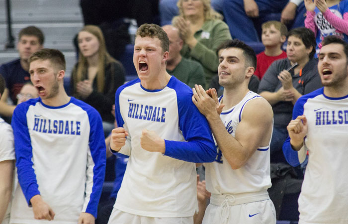 Jonathan Wilkinson, Noah Kalthoff and The Greeks enjoy Hillsdale's 77-61 win over Trevecca Saturday afternoon. Photo by MaryKate Drews