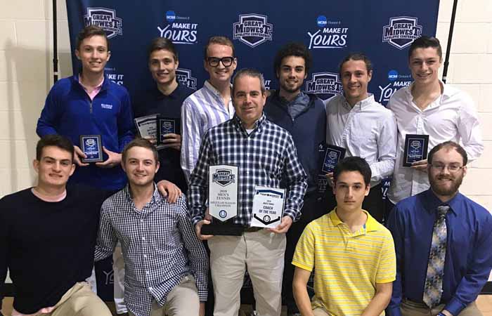 Head coach Keith Turner (center) poses with his team and his team's awards at Thursday night's G-MAC Tennis Awards Banquet at Kentucky Wesleyan. Photo by Kamryn Matthews
