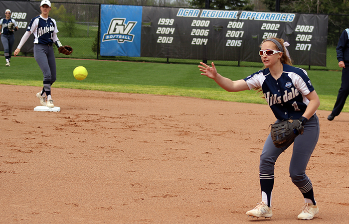 Amanda Marra tosses a ball to Emma Johnson for an out in Hillsdale's 1-0 NCAA Regional win over Grand Valley State. Photo by Brad Monastiere