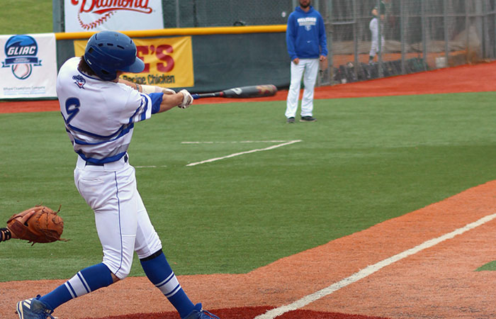 Senior Ethan Wiskur hits his 12th home run of the season during Hillsdale's GLIAC Tournament win over Wayne State Friday. Photo credit: Brad Monastiere