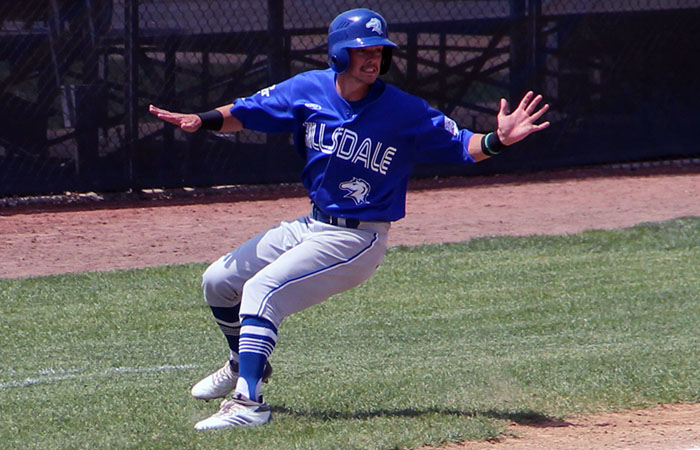Senior Colin Hites holds up a 3rd base during a third-inning rally by the Chargers at the NCAA Division II Midwest Regional Thursday. Photo by Brad Monastiere
